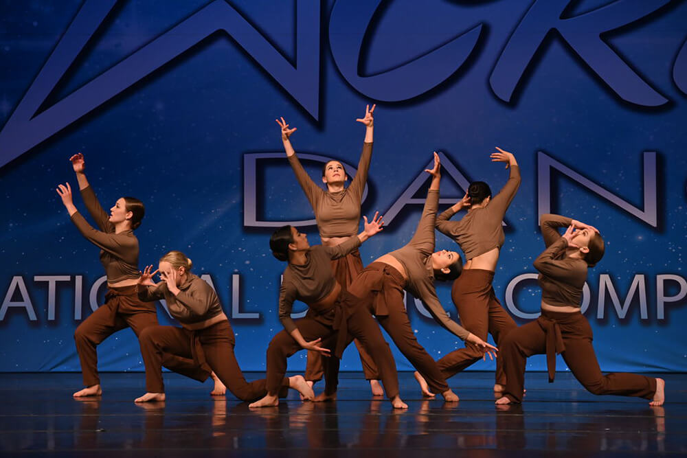 Dance group performing on stage at CRU Dance nationals